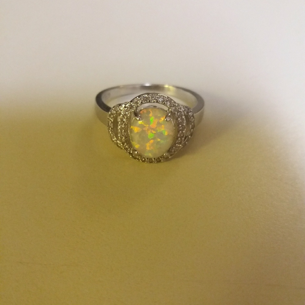 Genuine white fire opal and white Topaz ring
